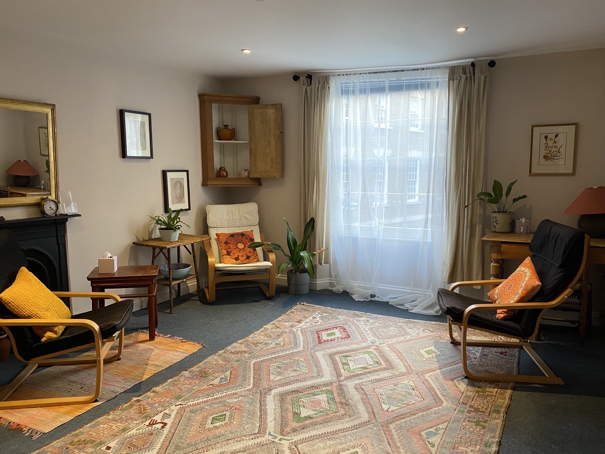Spacious therapy room with 3 chairs at The Practice Rooms in Exeter