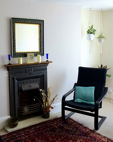 Therapy room with chair, fireplace and hanging plants at The Practice Rooms in Salibsury