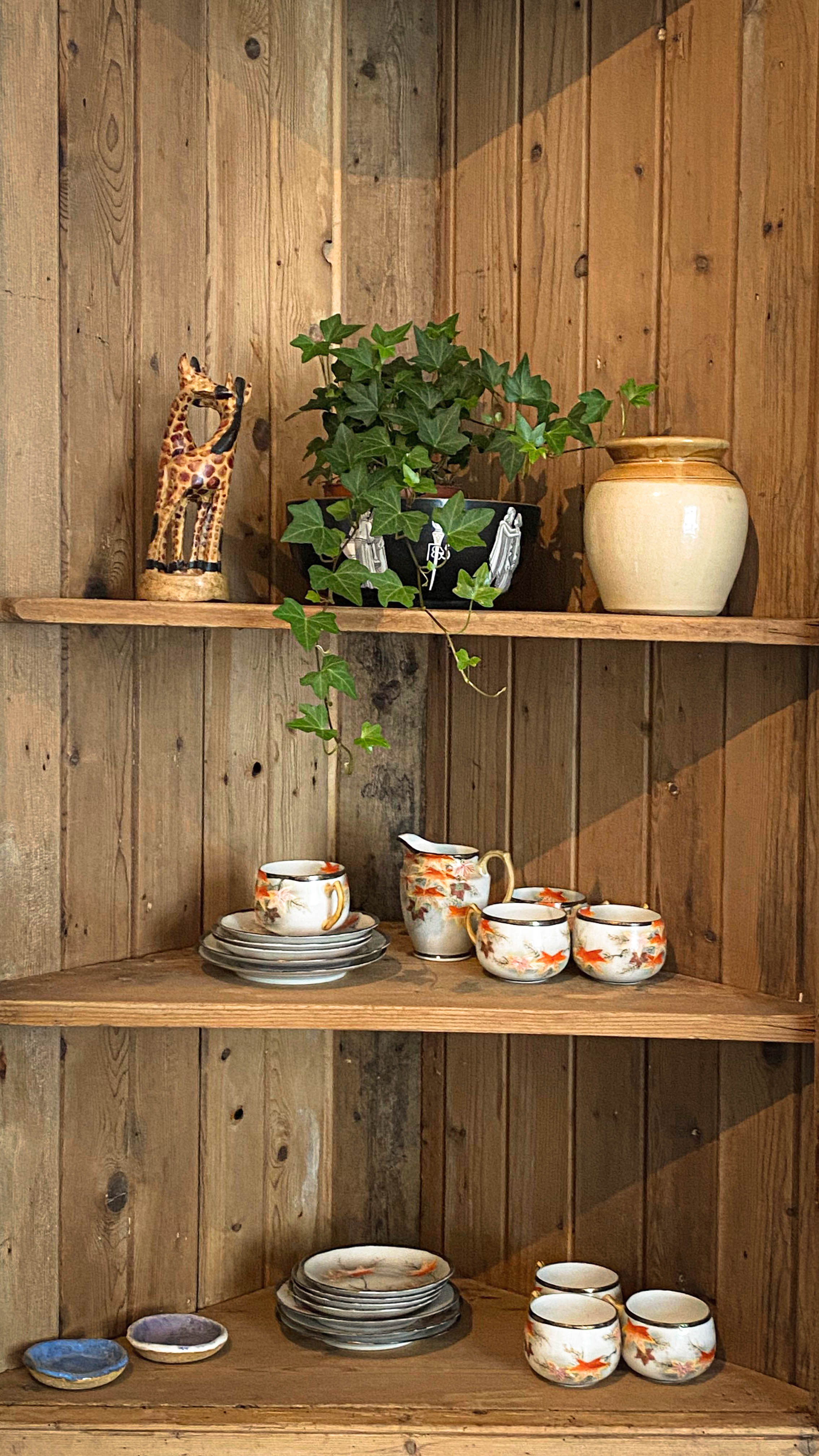Tea cups and saucers on a corner unit