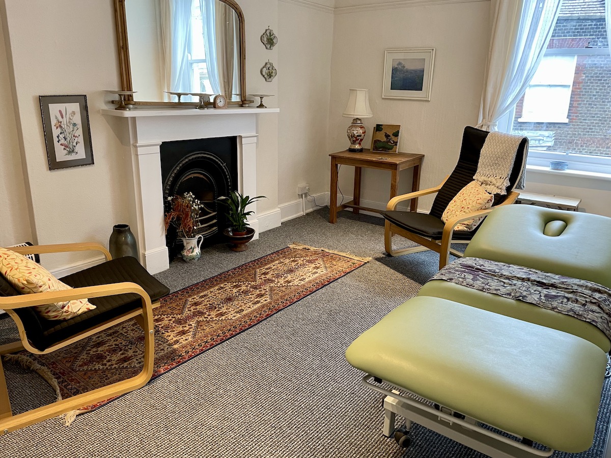 Therapy room with a green hydraulic couch