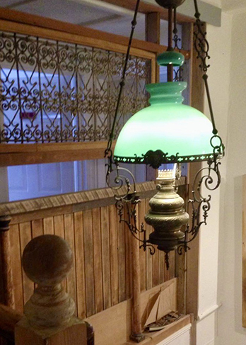 Green hanging lamp in the staircase